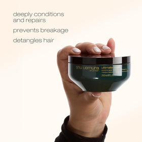 shu uemura art of hair 2.5 fl oz jar next to ruler for size and portability