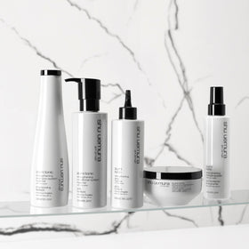 shu uemura art of hair bottle on bathroom shelf lifestyle for daily routine benefit