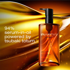 shu uemura bottle in hand to show product scale and convenient 15.2 oz size