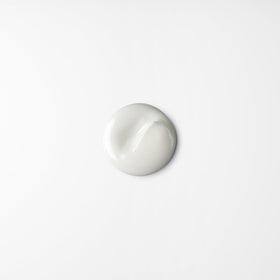 shu uemura art of hair next to a travel-sized item showing compact 2.54 oz jar for carry-on convenience