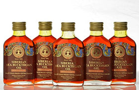Siberian Treasure 100 ml bottle next to common items to show scale and volume