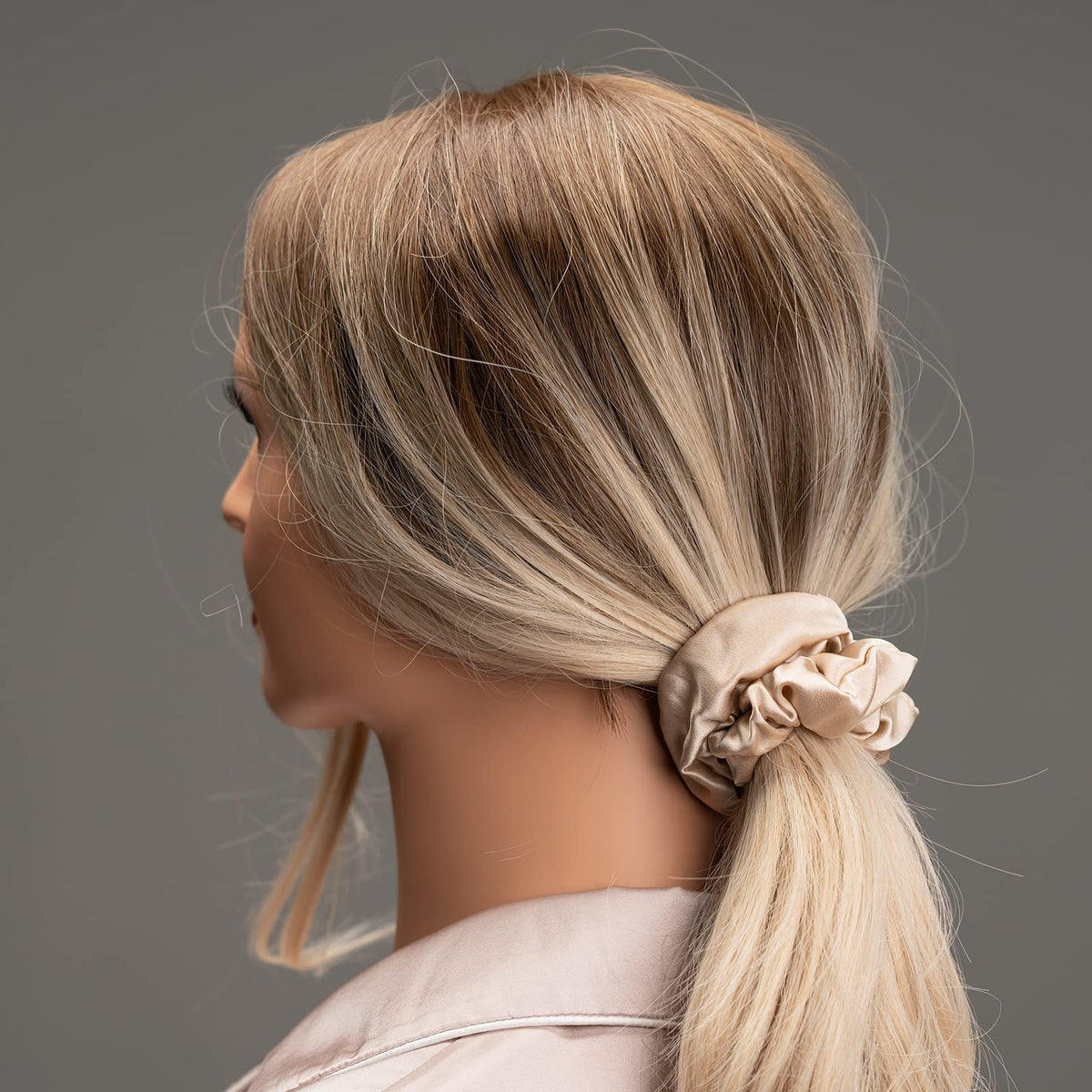 Silmer flatlay of pink, peacock blue, apricot scrunchies showcasing color variety