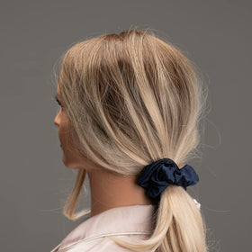 Silmer scrunchie worn in ponytail showing secure hold with less friction