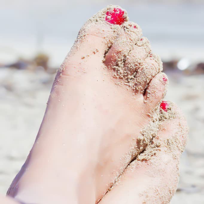 SILPECWEE worn with sandals in a beach setting showcasing long-wear visual impact