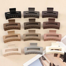 Sisiaipu clips held in hand showing scale and easy portable convenience