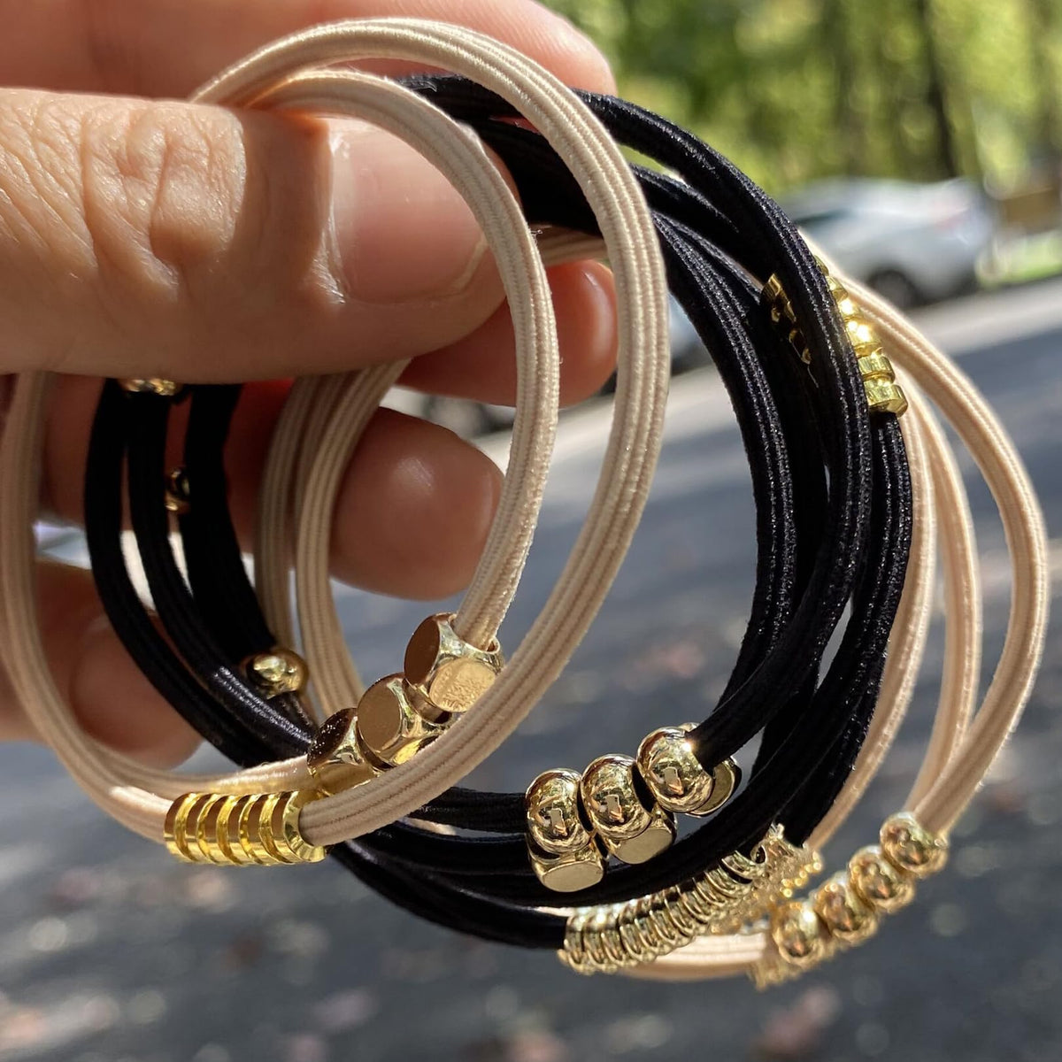 SISYOUP hair tie worn as bracelet on wrist for on-the-go styling