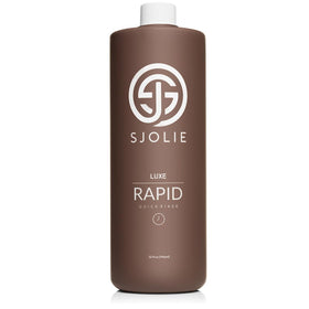 SJOLIE SUNLESS front label of 32oz bottle showing product name and benefits