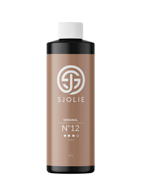 sjolie sunless front bottle showing label and dark tanning solution for confident bronze