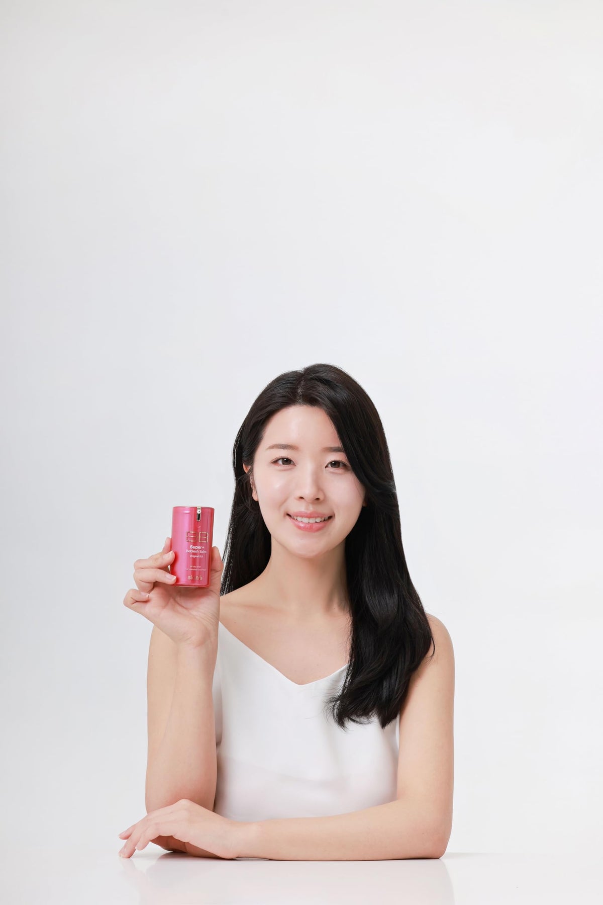 SKIN79 open cap dispensing BB cream highlighting controlled application