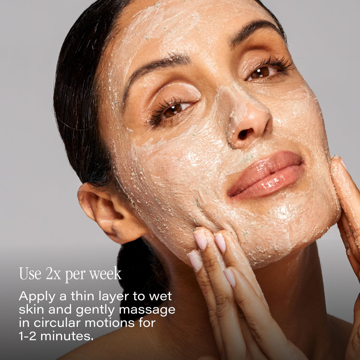 SKINN DermAppeal in hand scale demonstrating 2oz travel-friendly size and easy handling