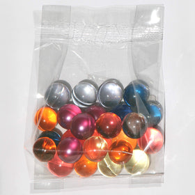 SKLEER pearls melting on bathwater surface releasing fragrance and oils