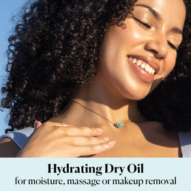 massaging Sky Organics oil into forearm showing hydration and smooth skin benefit