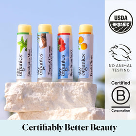 Sky Organics tropical coconut tube beside coconut piece showing creamy scent benefit