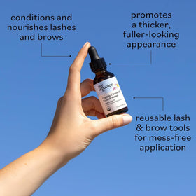 Sky Organics drop dispensing oil onto applicator demonstrating precise nightly application