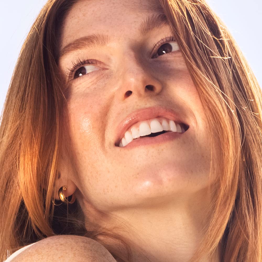 Sky Organics applied to hair mid-lengths as a conditioning treatment for shine