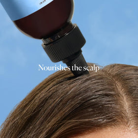 Person applying Sky Organics to hair demonstrating scalp stimulation benefit