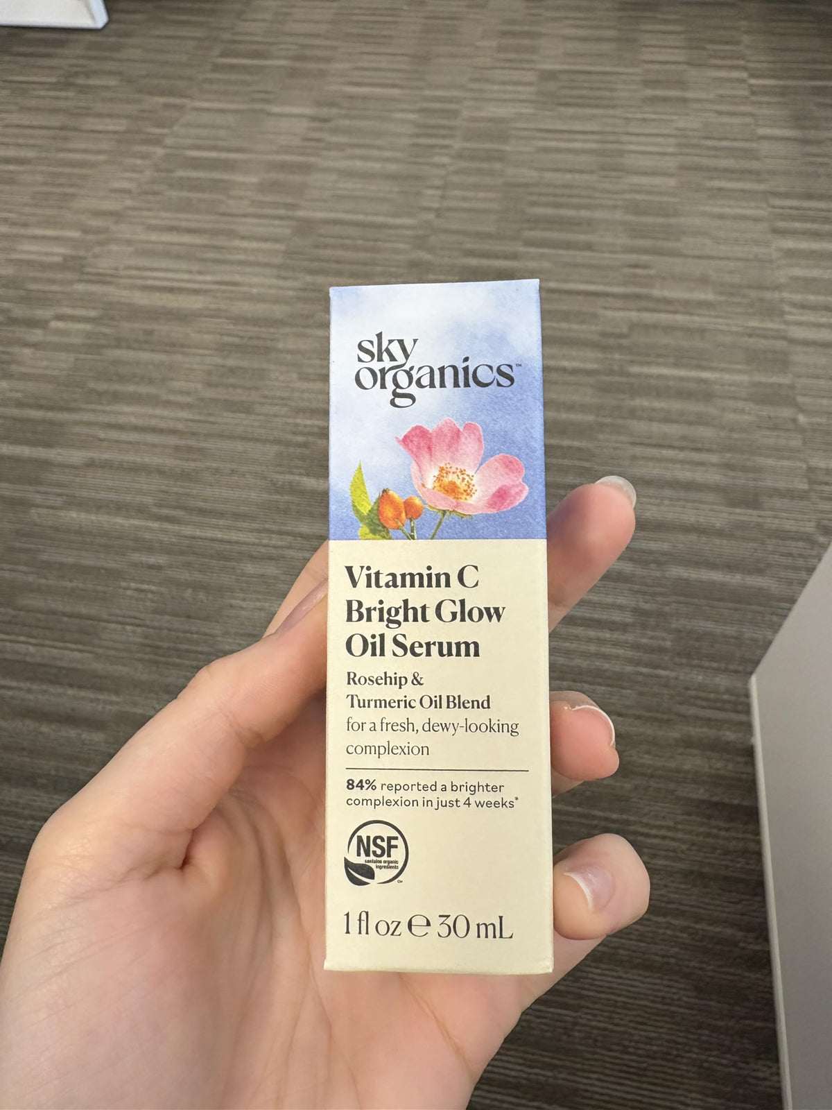 Sky Organics serum being applied to cheek showing hydration and dewy finish