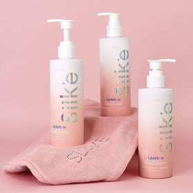 Sleek'e Silk'e held in hand to show 250ml scale and travel-friendly convenience