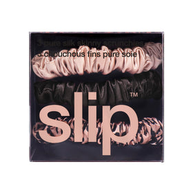 SLIP rose gold pure silk scrunchie reflecting light for glossy finish