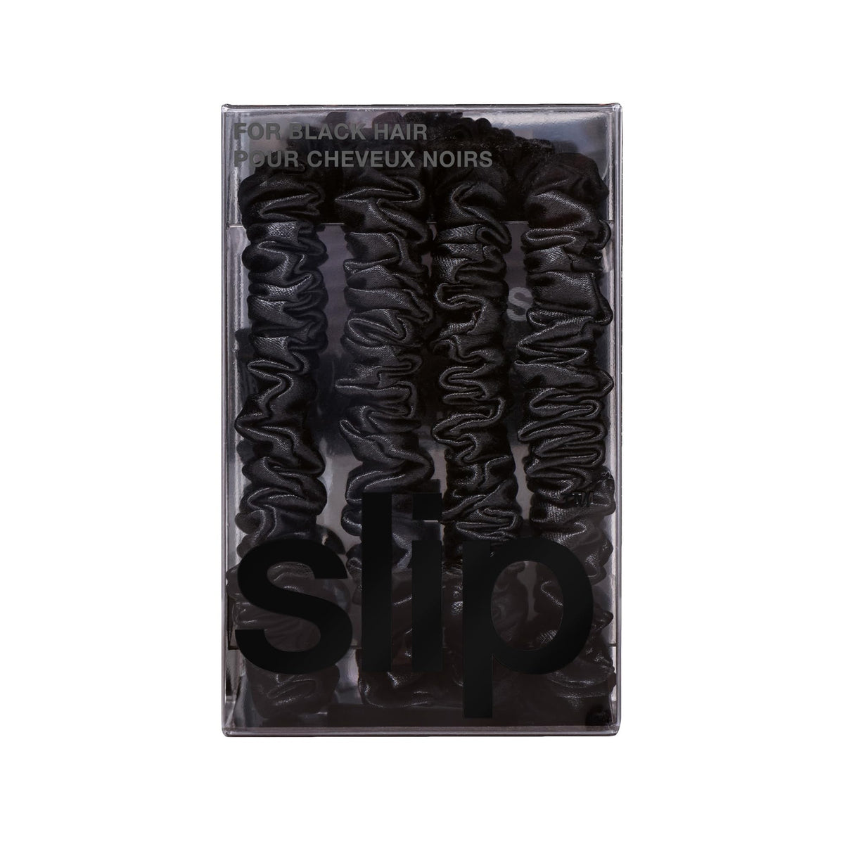 SLIP scrunchie on nightstand suggesting gentle overnight protection and hair health