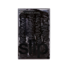 SLIP scrunchie on nightstand suggesting gentle overnight protection and hair health