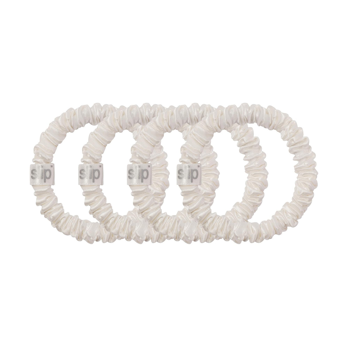 Slip scrunchie holding a low bun to show secure non-damaging hold