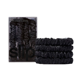 SLIP front packaging showing black silk scrunchies and set presentation benefits hair care