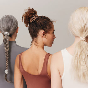 SLIP scrunchie worn on wrist showing convenient storage and stylish access