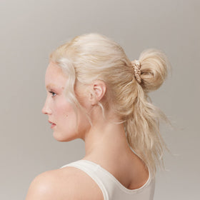 SLIP scrunchie in a ponytail on model demonstrating daywear styling benefit