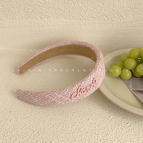 sluxa pink headband worn in hair demonstrating secure fit and polished look