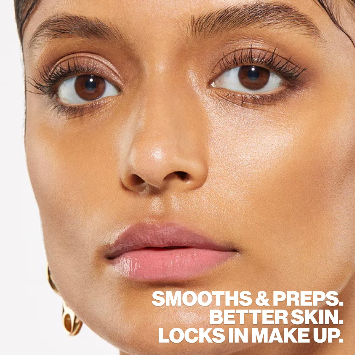 Smashbox travel-size next to passport emphasizing portability and travel-friendly hydration