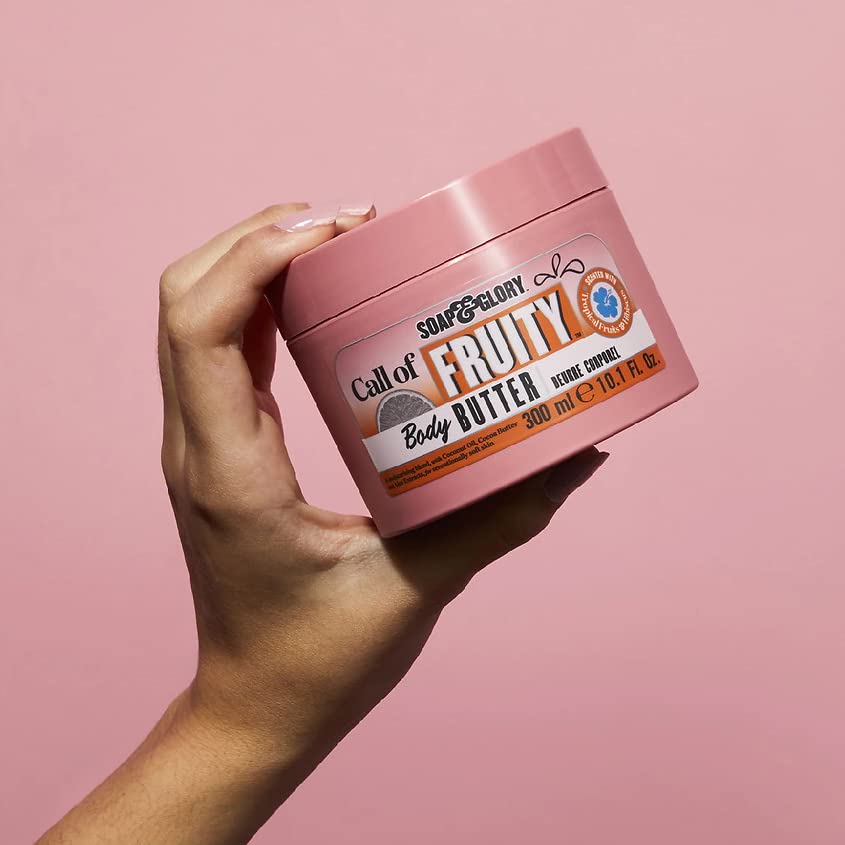 Hand scooping Soap & Glory body butter to demonstrate easy absorption and soft skin