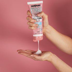 Soap & Glory bottle in hand for size comparison, showing generous 8.4 fl oz capacity
