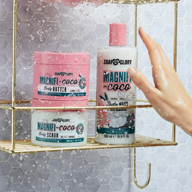 Soap & Glory bottle held in hand to convey 16.9 fl oz scale and portability