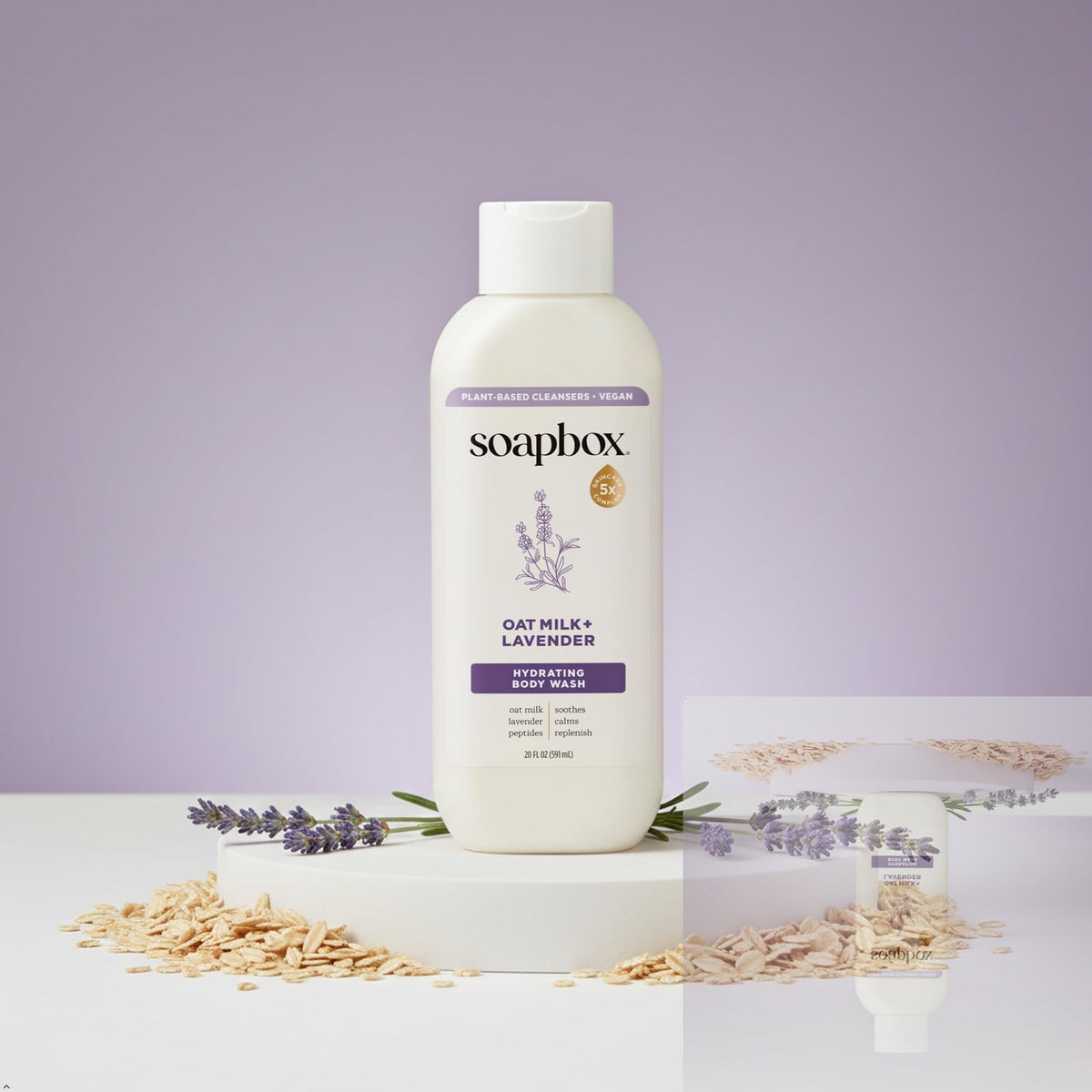 Person using Soapbox body wash in shower creating soft cleansing lather
