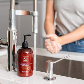 Soapbox three bottles on bathroom counter illustrating generous three-pack supply