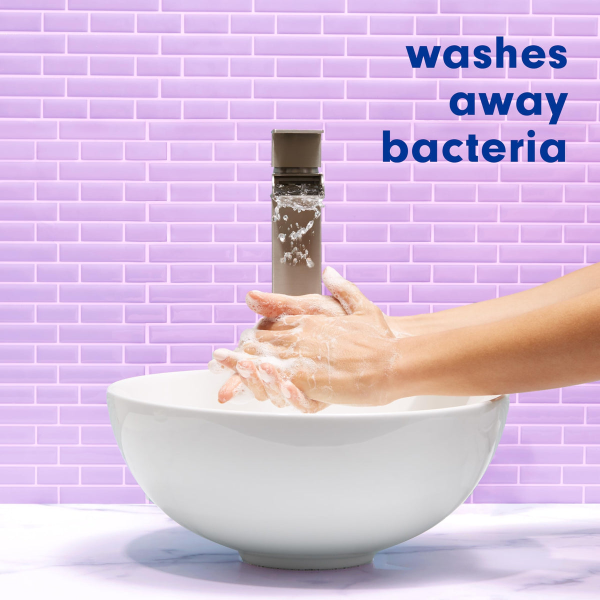Person washing hands with Softsoap demonstrating effective cleansing benefit