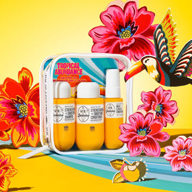 Sol de Janeiro milky leave-in spray in hand illustrating detangling and heat protection