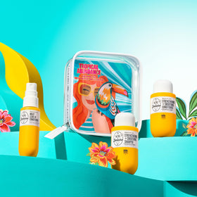 Sol de Janeiro travel set beside toiletries showing TSA-friendly portability benefit