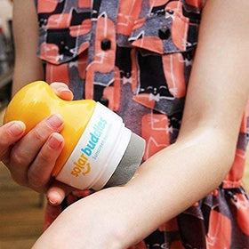 Solar Buddies applied by parent at beach demonstrating quick, mess-free sunscreen use