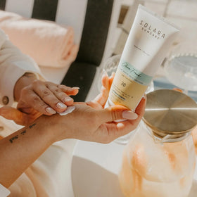 SOLARA SUNCARE application on forearm showing smooth, non-greasy finish