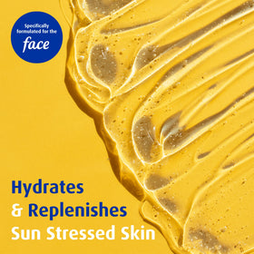Applying Solarcaine to cheek to soothe sun-stressed skin quickly