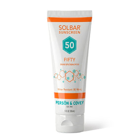 Solbar Fifty front tube showing SPF 50 branding and travel-ready design benefit: compact portability