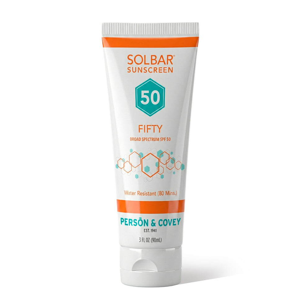 Solbar Fifty front tube showing SPF 50 branding and travel-ready design benefit: compact portability