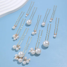soulshow in-use bridal updo with pins adding refined pearl accents and photo-ready finish