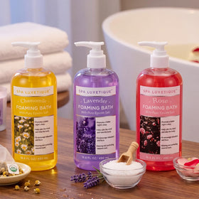 spa luxetique lifestyle bathroom scene with candles and bath full of bubbles for calming ambiance
