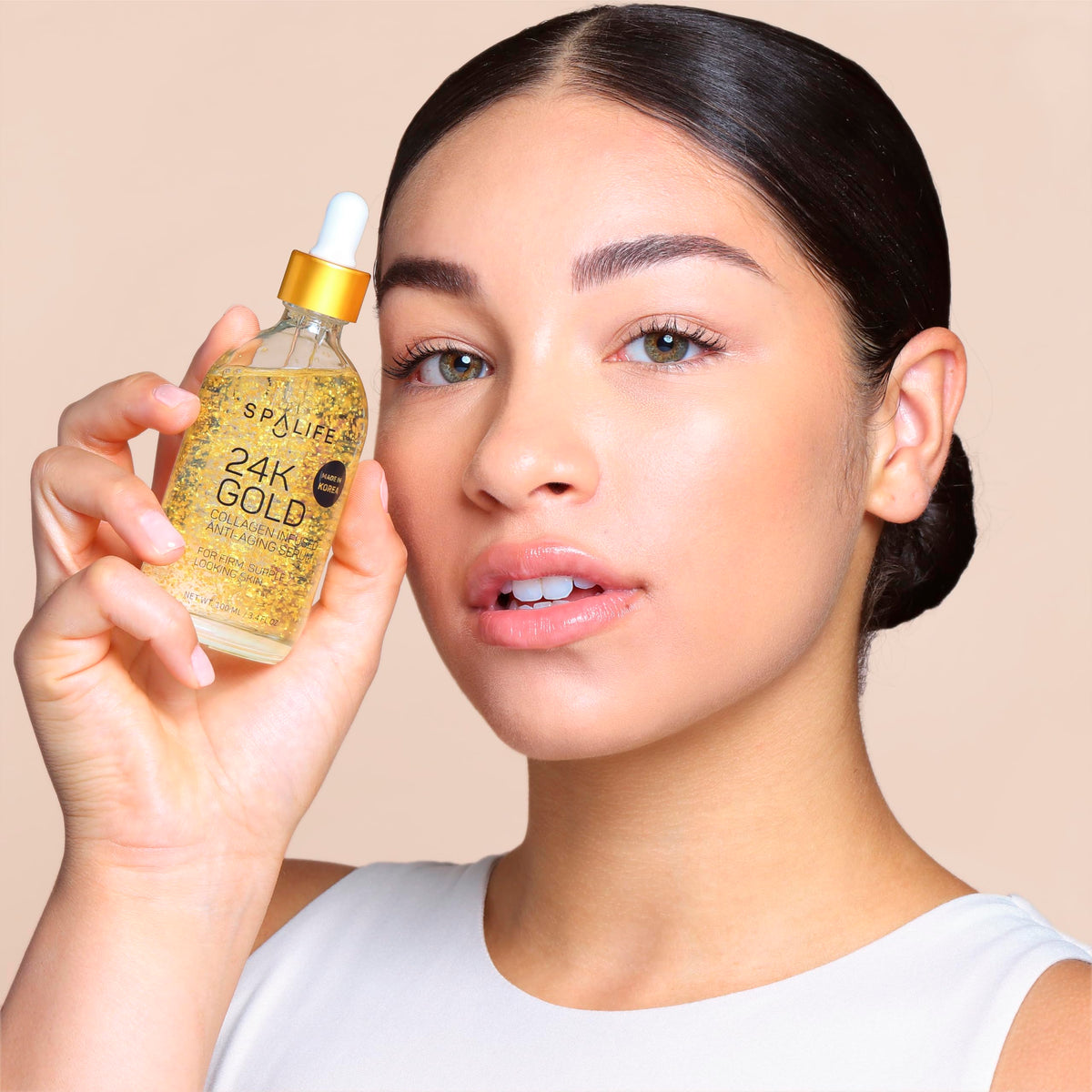 SpaLife serum swatched on hand displaying lightweight texture and hydration