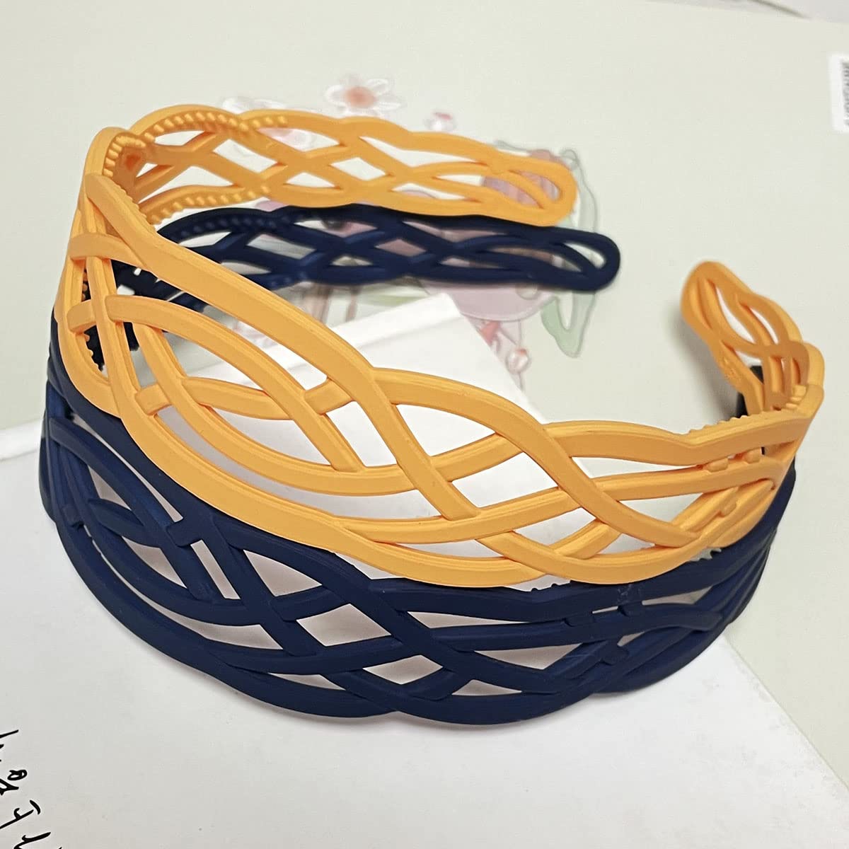 Springtime headband held in hand to show true size and lightweight benefit