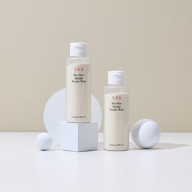 Model applying SRB enzyme powder foam to face demonstrating gentle massage and pore-clearing benefit