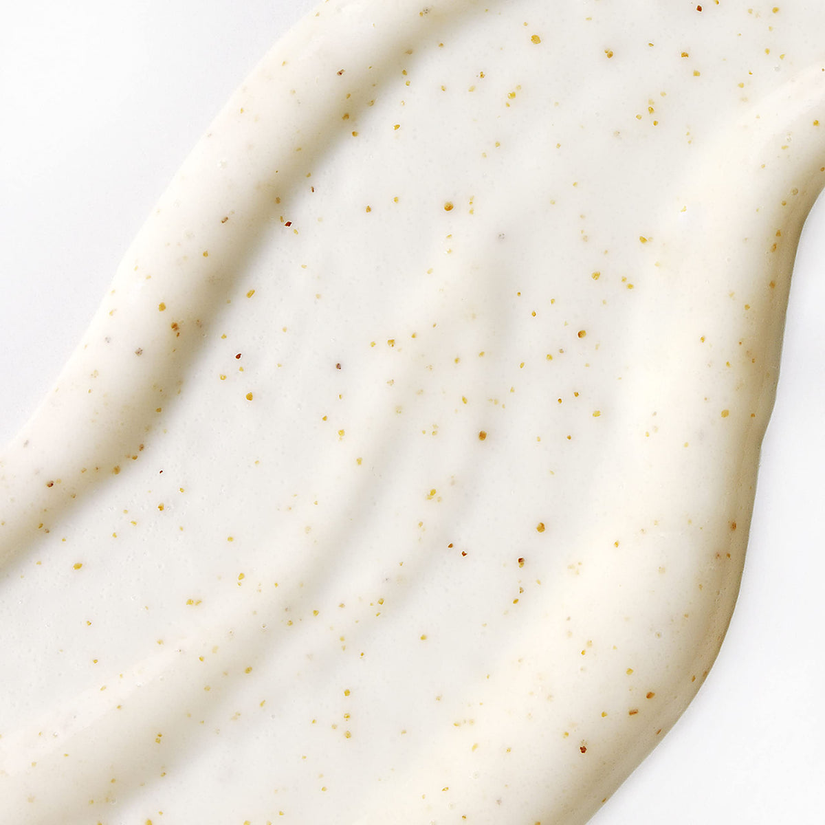 St. Ives close-up cream texture highlighting gentle exfoliant particles for smooth skin